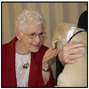 Marge Wright and Wallace holding a puppy